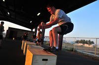 An airman performs a box jump.