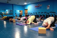 Students hold a twisted child’s pose during a yin yoga class at the McGuire Fitness Center, Joint Base McGuire-Dix-Lakehurst, N.J.