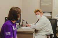 Medical provider conducts a medical evaluation with an applicant